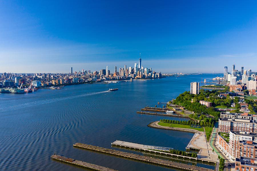 Union City Insurance - Aerial View of New Jersey, the Hudson River, and Manhattan, on a Sunny Cloudless Day